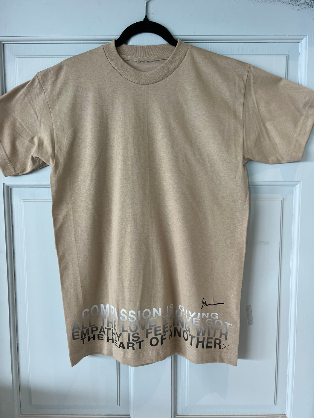 Unisex Compassion Crewneck Short sleeve tee shirt in Sand