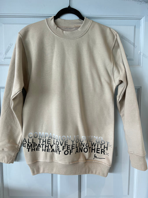 Unisex Compassion Crewneck Long sleeve Sweatshirt in Sand